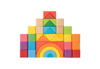 Colorful wooden blocks arranged as castle with rainbow semicircle base, isolated on a transparent background