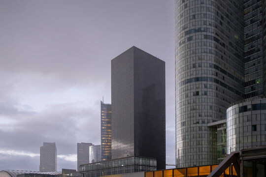 Architecture and modern towers dominate La Defense, paris with a corporate skyline built from reflections, verticality, business and urban finance