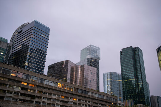 A corporate skyline emerges in La Defense, paris as architecture and modern towers highlight reflections, verticality, business and urban finance