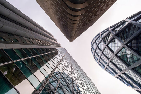 Modern towers in La Defense, paris create a corporate skyline where architecture, reflections and verticality support business and urban finance