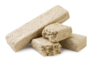 Halva bars and pieces close-up on a white. Isolated
