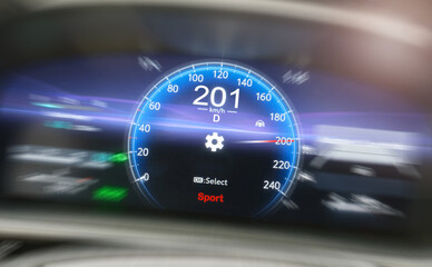 A car dashboard driving 201 kilometers per hour, selective focus