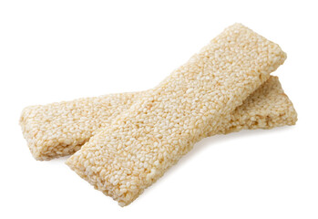 Bars with sesame seeds, kozinaki close up on a white. Isolated