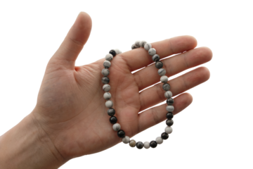 hand holding beautiful beads necklace . Isolated on transparent background, png