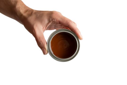 human hand holding paint can with brown paint . Isolated on transparent background, png