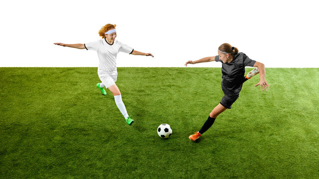 Female footballers rushing toward ball in high-speed competitive moment. Concept of match coverage, sports advertising, youth training programs, team motivation.