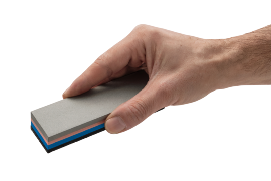 human hand gently holding a rectangular sharpener tool  . Isolated on transparent background, png