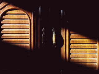 Elegant Wooden Shutters with Light and Shadow Contrast Effects