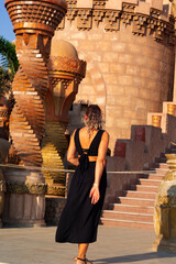 portrait of beautiful woman standing near the al sahaba mosque, sharm el sheikh