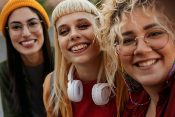 Happy young women smiling together, enjoying friendship