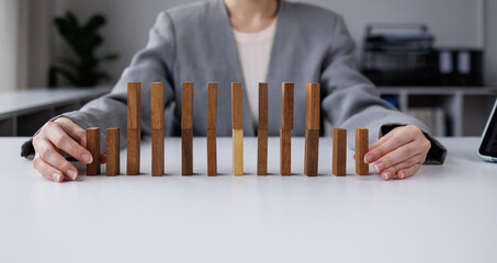 A hand put a block in the word TRUST symbolizes the importance of each element in creating and maintaining trust in relationships or business