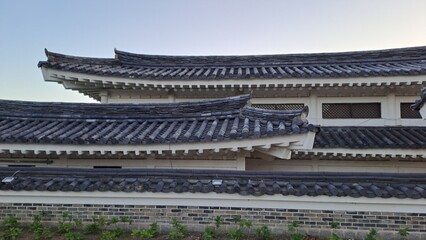 Fototapeta premium traditional korean hanok roof with curved tile eaves and lattice windows