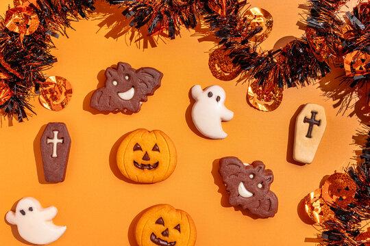 Halloween cookies on a festive orange table setting