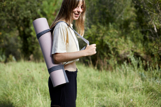 Woman practicing meditation in a serene forest