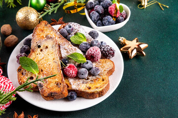 Leftover Christmas Spiced Stollen French Toasts, sweet fried stollen toasts with sugar powder and berries, Christmas morning dessert snack