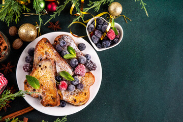 Leftover Christmas Spiced Stollen French Toasts, sweet fried stollen toasts with sugar powder and berries, Christmas morning dessert snack