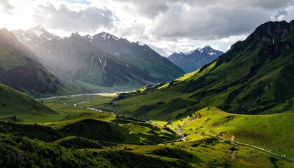 A majestic mountain landscape bathed in dramatic sunlight, featuring rolling green hills, a meandering river, and distant snow-covered peaks.