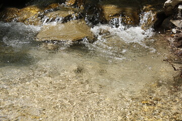 A small, beautiful mountain waterfall