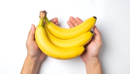 Hands holding a bunch of ripe yellow bananas on white background.