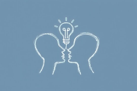 Two heads connected by a light bulb: a symbol of creative collaboration and shared ideas