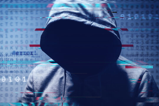 Faceless hooded hacker surrounded by digital computer code and binary digits, concept of cybercrime, data breach, and online security.