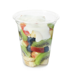 Tasty fruit salad with yogurt in plastic cup isolated on white