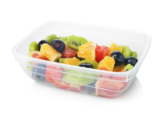 Tasty fruit salad in plastic container isolated on white. Healthy snack