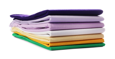 Stack of colorful clothes isolated on white