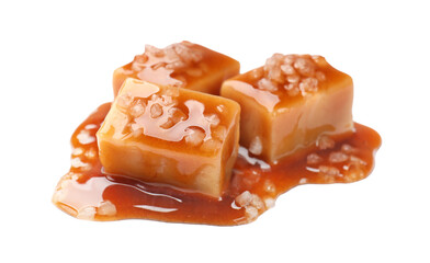 Tasty candies with salt and caramel sauce isolated on white