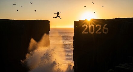 Silhouette of a person jumping across a chasm between two cliffs towards the sunrise with the year 2026 visible on the cliff face