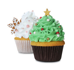 Festively decorated Christmas cupcakes isolated on white