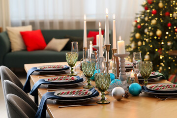 Festive table setting with Christmas decor at home