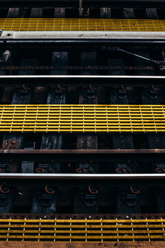 Urban rail tracks with vibrant yellow highlights