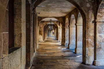Obraz premium Historic Stone Arcade Corridor in Black and White