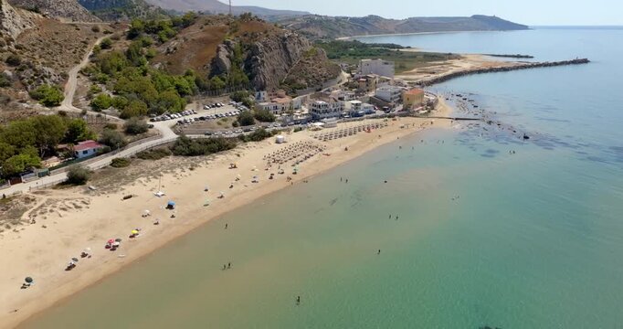 Aerial view of the beach and coast of Siculiana Marina, in province of Agrigento, Sicily, Italy. It is a small coastal village overlooking the Mediterranean Sea, whose waters are blue and turquoise.
