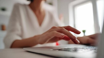 Person's hand typing on laptop with glowing red security padlock icon overlaid, symbolizing data protection, cybersecurity risks, privacy and digital threats - Powered by Adobe