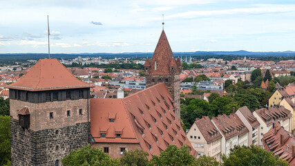 Cityscape with historic old town, traditional architecture, medieval rooftops, narrow streets of Nuremberg, Germany. Concept of tourism, documentaries, cultural content, European heritage.