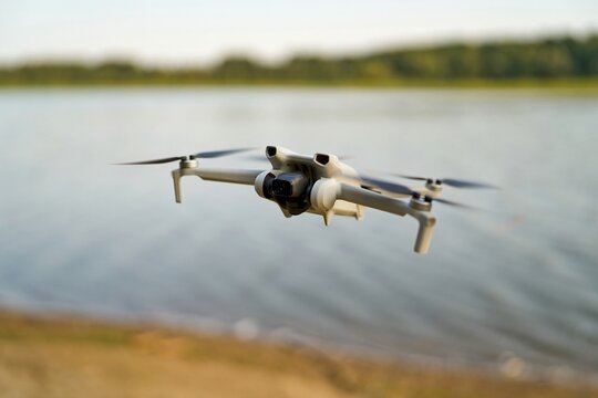 Advanced technology drone hovering over calm air