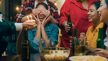 Group of young adult Asia friend surprised with birthday cake and drinking alcohol beer and fun...