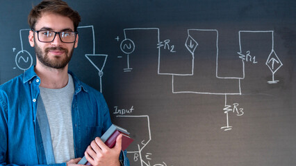 university student writing on blackboard