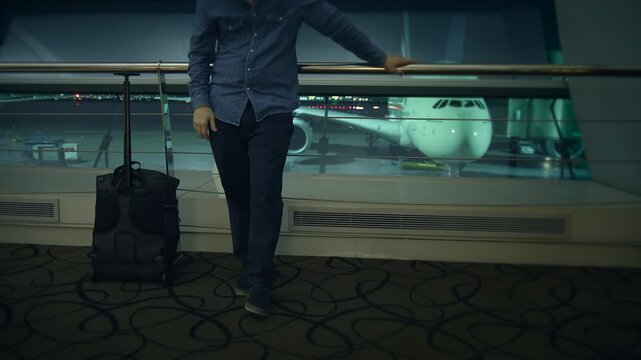 An Emotional Traveler in an Airport Deeply Lost in Thought and Reflection Amidst the Chaos