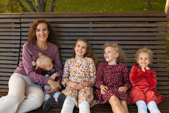 Happy family enjoying time together on a park bench