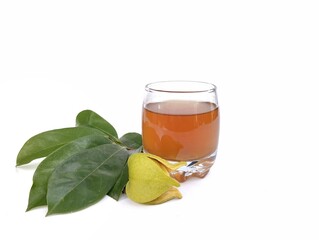 Soursop leaf boiled water (annona muricata) in glass with fresh leaf. Healthy drink lifestyle 
