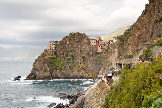 Manarola train station in famous village with colorful houses on cliff over sea in Cinque Terre in autumn, Ligury, Italy