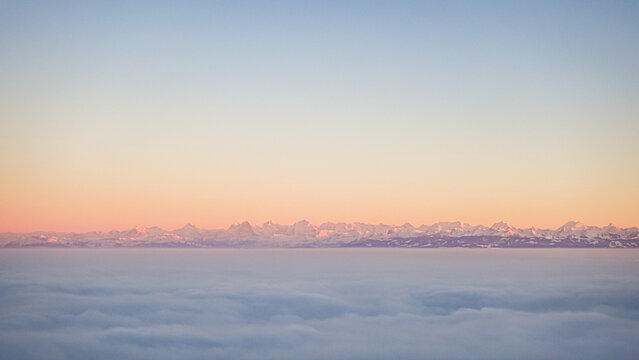 Scenic winter sunrise over snowy Jura mountains