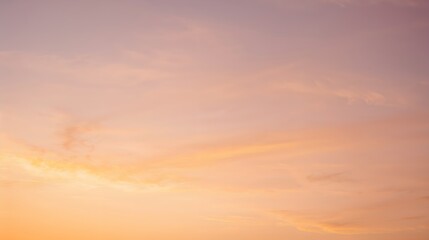 Fototapeta premium a serene display of a pastel-colored sky during sunrise or sunset, blending hues of pink and gold, offering a peaceful and beautiful view