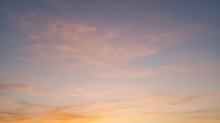 Fototapeta premium a captivating sunset sky with clouds bathed in warm hues of orange and pink, creating a serene and picturesque landscape