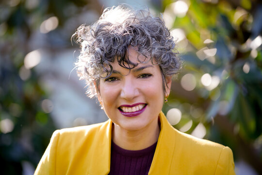 Confident businesswoman with a bright smile outdoors
