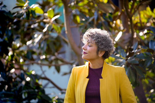 Confident businesswoman enjoying peaceful moment outdoors
