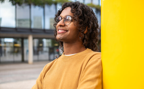 Non-binary individual enjoying city life in style
